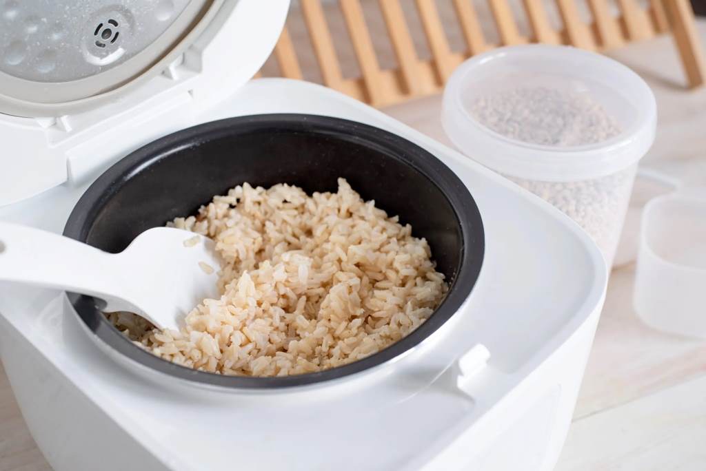 Fluffy white rice in Aroma mini cooker inner pot after perfect cooking cycle