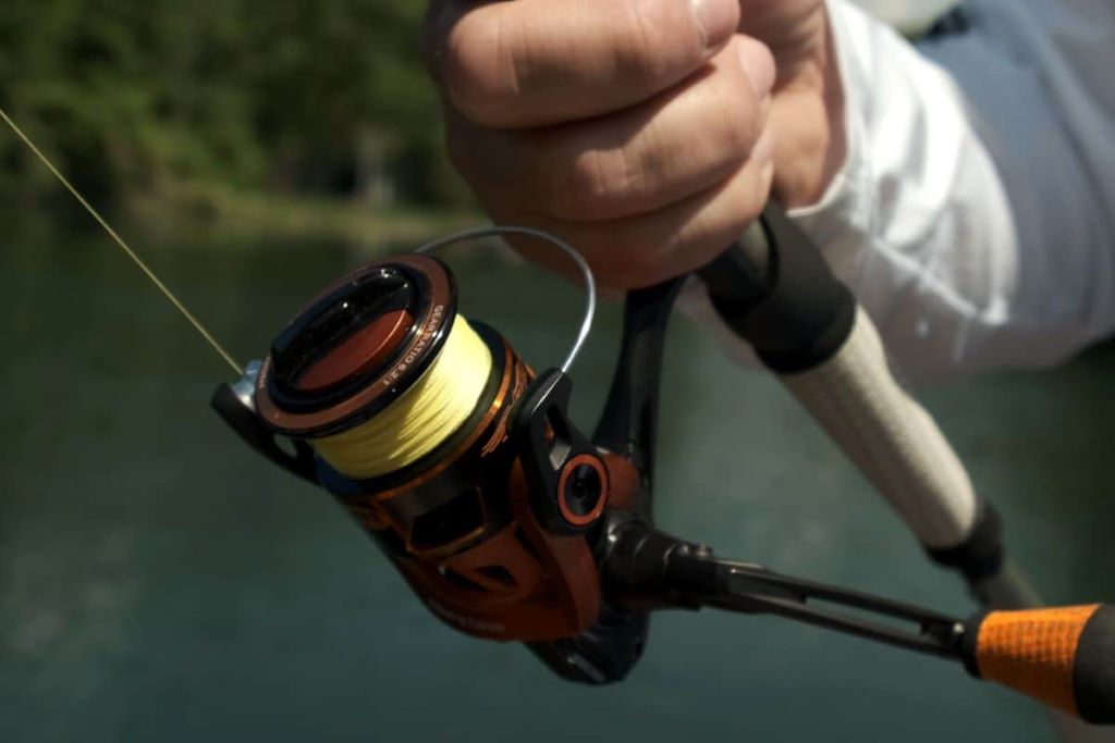 Fishing rod and reel rigged with the ideal line for specific fishing conditions